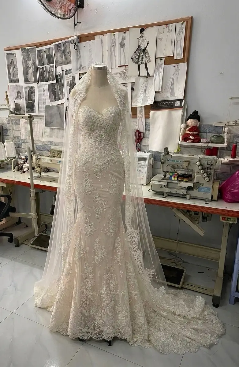 Mermaid wedding dress silhouette fitted through the hip and thigh with flare below the knee, custom-made by VI Dressmakers Vietnam