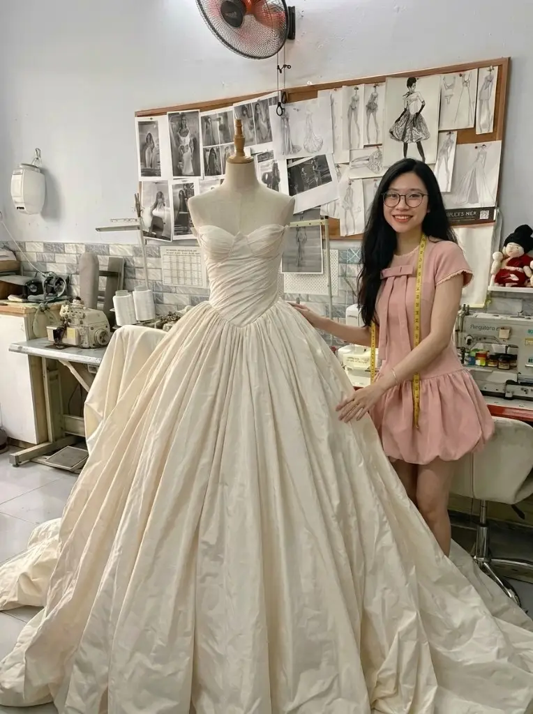 Vi, founder and lead designer at the VI Dressmakers Vietnam atelier