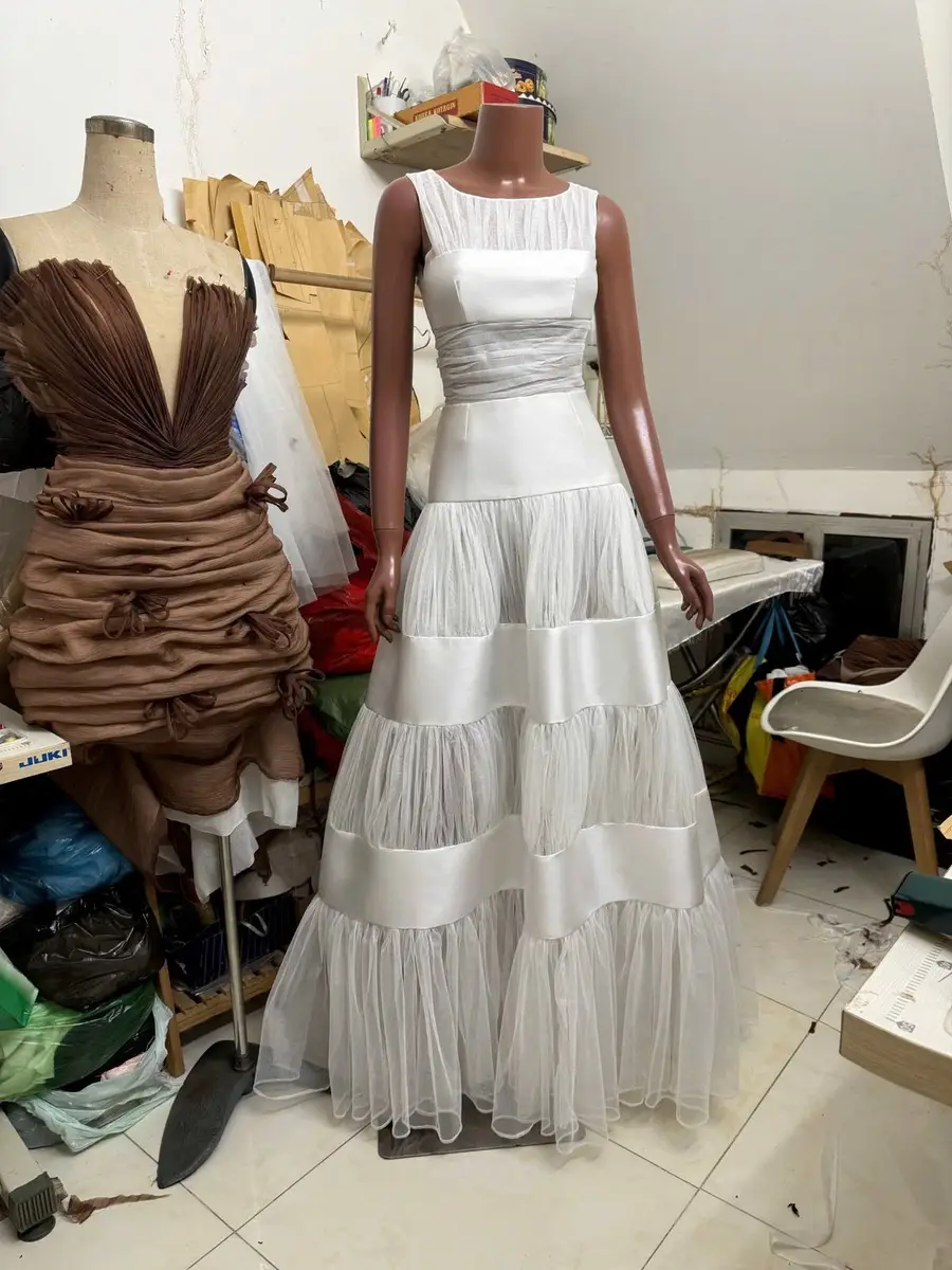 Finished custom gown on the dress form at the Vietnam atelier