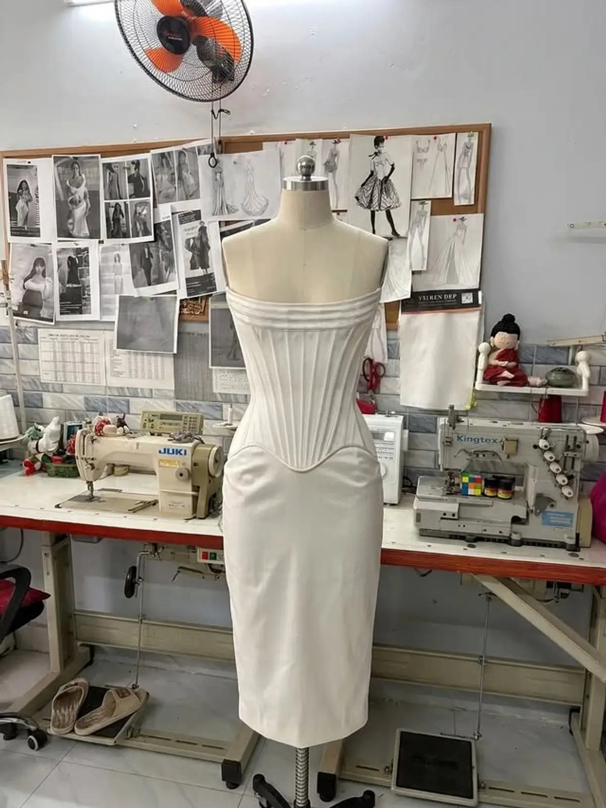 VI Dressmakers atelier tools, fabrics, and sewing workspace in Vietnam